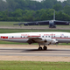 Lockheed L1049H Constellation (N6937C) painted in historic TWA livery taxis past a Boeing B-52H Stratofortress at Barksdale Air Force Base in 2004. (US Air Force)